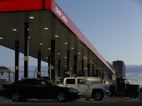 Vehicles fill up at a gas station  in Lloydminster, Alberta on Thursday, December 22, 2016