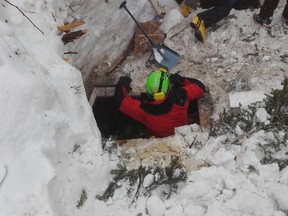 In this undated photo released Sunday, Jan. 22, 2017, rescuers work in the area of the avalanche-hit Rigopiano hotel