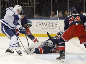 Toronto Maple Leafs' forward Leo Komarov, left, is denied by New York Rangers' goaltender Henrik Lundqvist during NHL action Friday at Madison Square Garden. The Leafs were 4-2 winners, giving them at least a point in each of their last nine road games.