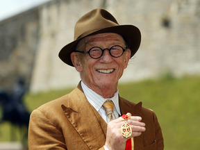 Sir John Hurt after being awarded a knighthood by Queen Elizabeth II on July 17, 2015.