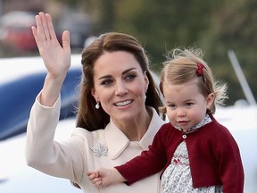 Catherine, Duchess of Cambridge and Princess Charlotte wave from Victoria Harbour on October 1, 2016 in Victoria, Canada