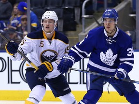 Auston Matthews of the Toronto Maple Leafs battles for position with Jack Eichel of the Buffalo Sabres at the Air Canada Centre in Toronto on Tuesday January 17, 2017.