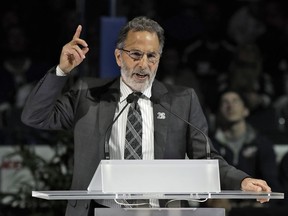 Columbus Blue Jackets coach John Tortorella speaks at Martin St. Louis' jersey retirement ceremony in Tampa Bay on Jan. 13.