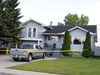 Police tape surrounds the home of Alvin and Kathy Liknes in Calgary after their disappearance along with their five-year-old grandson Nathan O'Brien.