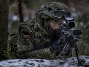 A Lithuanian soldier practices during a NATO military exercise, 'Iron Sword,' at the Rukla military base some 130 km west of the capital Vilnius, Lithuania on Nov. 28, 2016.