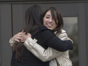 Michelle Susan Hadley, right, hugs Orange County District Attorney Chief of Staff Susan Kang Schroeder after being cleared of all charges in a complicated plot to frame her in Fullerton, Calif., Monday, Jan. 9, 2017.