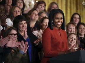 First lady Michelle Obama smiles as she speaks at the 2017 School Counselor of the Year ceremony in the East Room of the White House in Washington, Friday, Jan. 6, 2017.