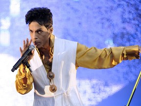 Prince performs on stage at the Stade de France in Saint-Denis, outside Paris, on June 30, 2011