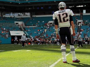 New England Patriots quarterback Tom Brady warms up before facing the Miami Dolphins on Jan. 1.