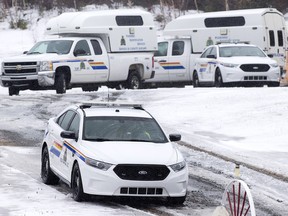 Police vehicles are seen outside a residence in Upper Big Tracadie, N.S. on Wednesday, Jan. 4, 2017. RCMP said four bodies were found inside the home in northeastern Nova Scotia saying the public was not at risk.