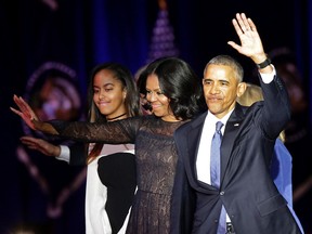 First Lady Michelle Obama, President Barack Obama and daughter Malia after the President delivered his farewell address in Chicago, Illinois on January 10, 2017