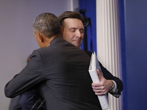 President Barack Obama hugs White House press secretary Josh Earnest during his final daily press briefing, Tuesday, Jan. 17, 2017