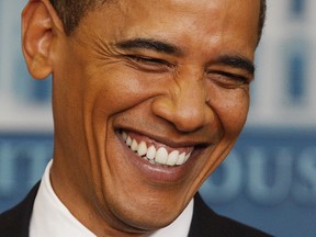 In this June 23, 2009, file photo, President Barack Obama smiles as he listens to a question during a news conference at the White House in Washington.