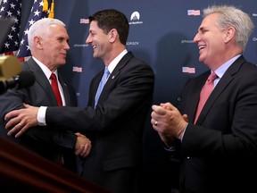 U.S. Vice President-elect Mike Pence (L) shares a laugh with Speaker of the House Paul Ryan (C) and Majority Leader Kevin McCarthy