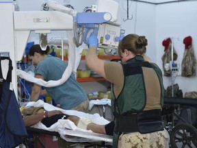 Canadian Armed Forces medical personnel X-ray a simulated patient during an exercise at the Role 2 medical facility in northern Iraq  on Nov. 7, 2016. The photo has been digitally altered to protect operational security.