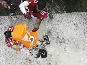 Atlanta Falcons head coach Dan Quinn is doused with Gatorade after his team beat the Green Bay Packers on Jan. 22.