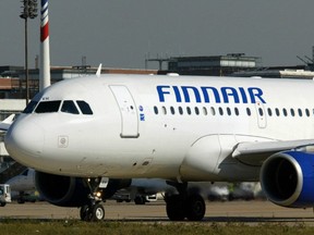 Picture taken September 30, 2003 shows a Finnair plane at Roissy Charles de Gaulle airport, near Paris.  Finnish airline Finnair said on December 2, 2008 it would temporarily lay off some 2,000 cabin crew employees next year in an attempt to cut costs in the face of the global financial crisis.