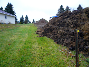 For almost a year, this manure pile sat on the edge of David and Joan Gallant’s property in Indian Mountain, N.B., as part of an escalating feud with their neighbours.