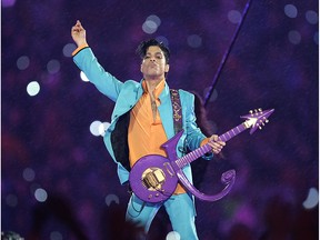 In this Feb. 4, 2007 file photo, Prince performs during the halftime show at the Super Bowl XLI football game at Dolphin Stadium in Miami.