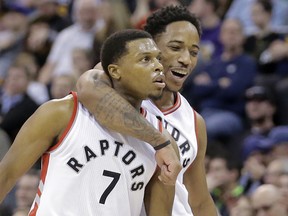 Toronto Raptors guards Kyle Lowry (left) and DeMar DeRozan celebrate against the Utah Jazz on Dec. 23, 2016.