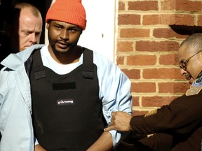 Ricky Gray is escorted from the county courthouse in Culpeper, Va. on Jan. 3, 2007.