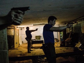 Participants of the Partisan courses train using Makarov pistols in the sports military-patriotic club Rezerv. MUST CREDIT: Photo for The Washington Post by Alexander Aksakov
Alexander Aksakov, For The Washington Post