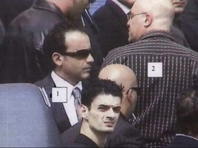 Giuseppe Torre, 1, and Guiseppe Annibale, 2, are shown in this police surveillance image from the funeral of mafia figure Domenico Macri on September 5, 2006.