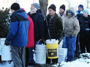 Vancouver residents line up outside Fire Hall #14 on Venables Street for free city-supplied salt which never arrived, in Vancouver, Wednesday, January 4, 2017.
