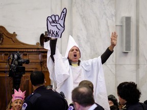 Code Pink activist Tighe Barry, dressed like a member of the KKK, disrupts the start of the Senate Judiciary Committee confirmation hearing for Senator Jeff Sessions