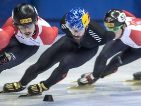 Canadian speedskater Charles Hamelin (centre) skates with teammates during a practice session in Montreal on Jan. 11.