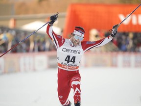 Canada's Alex Harvey crosses the finish line to win the men's 15km freestyle competition at the FIS Cross Country skiing World Cup event in Ulricehamn, Sweden, on Jan. 21