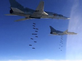 In this photo provided by the Russian Defense Ministry Press Service shows Russian air force Tu-22M3 bombers strike the Islamic State targets in Syria, Monday, Jan. 23, 2017