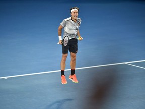 Roger Federer jumps to celebrate his victory over Rafael Nadal in the men's singles final of the Australian Open on Jan. 29.