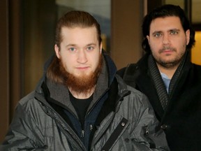 Tevis Gonyou McLean, left, leaves the Elgin Street courthouse on Jan. 6, 2017 with one of his lawyers, Biagio Del Greco, after being released on bail pending a terrorism peace bond hearing.