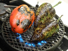 Students get a chance to roast green and red chile peppers during a cooking class at the Santa Fe School of Cooking. The peppers are a staple of Northern New Mexico cuisine, and locals spell them with an "e" we learn.