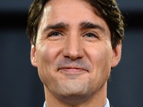 Prime Minister Justin Trudeau holds a press conference at the National Press Theatre in Ottawa on Monday, Dec. 12, 2016