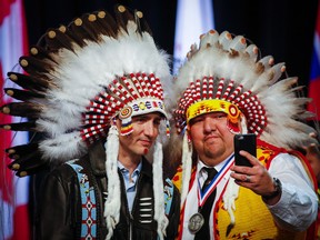 Prime Minister Justin Trudeau, left, poses for a selfie with Tsuu'Tina First Nation councillor Emil Starlight in early 2016
