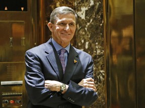 In this Dec. 12, 2016 file photo, National Security Adviser-designate Michael T. Flynn waits for an elevator in the lobby at Trump Tower in New York.