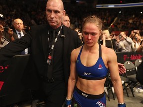 Ronda Rousey exits the octagon after her loss to Amanda Nunes in their UFC women's bantamweight championship bout at UFC 207 on Dec. 30, 2016 in Las Vegas.
