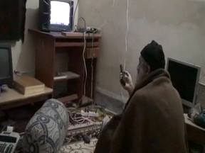 This still image from video released May 7, 2011 by the US Department of Defense Osama bin Laden wrapped in a blanket watching television