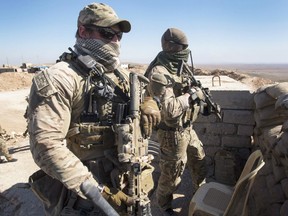 Canadian special forces look over a Peshmerga observation post, Monday, February 20, 2017 in northern Iraq.