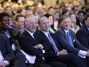 Kevin O'Leary, Rick Peterson and Maxime Bernier laugh during a Conservative Party leadership debate at the Manning Centre conference, on Friday, Feb. 24, 2017 in Ottawa.