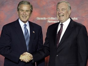 US President George W. Bush and Canadian Prime Minister Paul Martin shake hands during a joint press conference in Ottawa