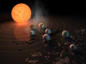 The TRAPPIST-1 star, an ultra-cool dwarf, has seven Earth-size planets orbiting it. This artist's concept appeared on the cover of the journal Nature on Feb. 23, 2017.