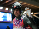 In this Feb. 9, 2014 file photo, Sam Edney waves during the men's singles luge competition at the Sochi Olympics.