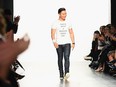 Designer Prabal Gurung takes a bow after presenting his Fall 2017 collection, wearing a feminist T-shirt.