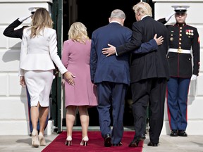 President Donald Trump (R), Israeli Prime Minister Benjamin Netanyahu (2nd R) and their wives first lady Melania Trump (L) and Sara Netanyahu walk into the White House on February 15, 2017 in Washington, D.C.