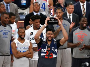 Anthony Davis of the New Orleans Pelicans celebrates with the 2017 NBA All-Star Game MVP trophy after the 2017 NBA All-Star Game at Smoothie King Center on Sunday in New Orleans.