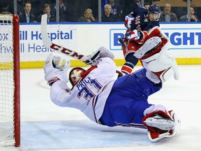 Montreal Canadiens goaltender Carey Price makes a diving save in the closing seconds of overtime against J.T. Miller of the Rangers at Madison Square Garden in New York on Tuesday night. The Canadiens edged the Rangers 3-2 in the shootout.