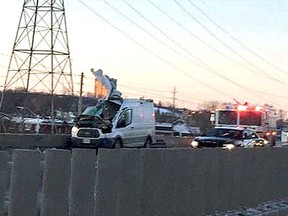 The roof of a white van was torn by a flying tractor trailer wheel and the driver killed in a crash Friday morning in Ottawa.